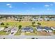 Aerial view of house with community and golf course view at 9836 Se 175Th Pl, Summerfield, FL 34491