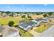 Aerial view of house on a golf course community at 9836 Se 175Th Pl, Summerfield, FL 34491