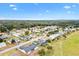 Aerial view of house and surrounding golf course at 9836 Se 175Th Pl, Summerfield, FL 34491