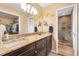 Elegant bathroom with granite countertops and a large walk-in shower at 9836 Se 175Th Pl, Summerfield, FL 34491