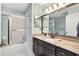 Bathroom with granite countertop and floral wallpaper at 9836 Se 175Th Pl, Summerfield, FL 34491