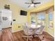 Casual dining area with a bay window offering a view of the backyard at 9836 Se 175Th Pl, Summerfield, FL 34491