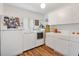 Laundry room with washer, dryer, and cabinets at 9836 Se 175Th Pl, Summerfield, FL 34491