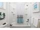 Bathroom with tub shower, white vanity, and ocean decor at 9945 Sw 100Th Terrace Rd, Ocala, FL 34481