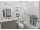 Clean bathroom with tub shower, white vanity and ocean decor at 9945 Sw 100Th Terrace Rd, Ocala, FL 34481