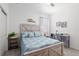 Bright bedroom with light wood bed frame and ocean decor at 9945 Sw 100Th Terrace Rd, Ocala, FL 34481