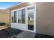 Home exterior showcasing a sunroom addition at 9945 Sw 100Th Terrace Rd, Ocala, FL 34481