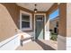 Quaint covered porch with a bench and a light fixture at 9945 Sw 100Th Terrace Rd, Ocala, FL 34481