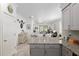 Kitchen island with granite countertops overlooks living room at 9945 Sw 100Th Terrace Rd, Ocala, FL 34481