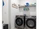 Laundry room with side-by-side washer and dryer at 9945 Sw 100Th Terrace Rd, Ocala, FL 34481