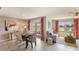 Bright dining area with sliding glass doors leading to a patio and water view at 10012 Se 161St Lane Rd, Summerfield, FL 34491