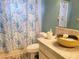 Clean bathroom with shower and decorative shower curtain at 10800 Sw 62Nd Ave, Ocala, FL 34476