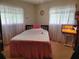 Cozy bedroom with a full-size bed and updated decor at 10800 Sw 62Nd Ave, Ocala, FL 34476