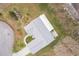 Top-down view of a single-story house featuring a gray roof and a spacious yard at 10882 Sw 62Nd Ave, Ocala, FL 34476