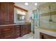 Elegant bathroom featuring dark wood cabinets and a large shower at 10882 Sw 62Nd Ave, Ocala, FL 34476