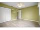 Bedroom with ceiling fan, double doors and wood-look tile floors at 10882 Sw 62Nd Ave, Ocala, FL 34476