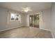 Bedroom with sliding glass doors to a sunroom at 10882 Sw 62Nd Ave, Ocala, FL 34476