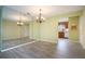 Bright dining room with large mirror and chandelier at 10882 Sw 62Nd Ave, Ocala, FL 34476