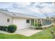 Rear view of house showcasing a patio and sunroom at 10882 Sw 62Nd Ave, Ocala, FL 34476