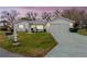 Single-story home with a two-car garage and well-manicured lawn at 10882 Sw 62Nd Ave, Ocala, FL 34476