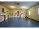 Garage has painted floor, cabinets, washer and dryer hookups at 10882 Sw 62Nd Ave, Ocala, FL 34476