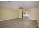 Living room with tile floors, ceiling fan, and access to a patio at 10882 Sw 62Nd Ave, Ocala, FL 34476