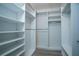 Bright walk-in closet with ample shelving and hanging space at 10882 Sw 62Nd Ave, Ocala, FL 34476