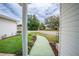 Curved walkway leads to the front door, with landscaping at 10882 Sw 62Nd Ave, Ocala, FL 34476