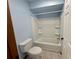 Clean bathroom with a tub and shower at 10895 Sw 90Th Ter, Ocala, FL 34481