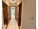 Hallway with closets and bathroom access at 10895 Sw 90Th Ter, Ocala, FL 34481