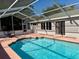 Screened pool with patio and house view at 10895 Sw 90Th Ter, Ocala, FL 34481