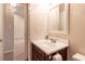 Small bathroom with vanity and mirror at 10918 Se 50 Ave, Belleview, FL 34420