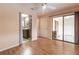 Bright bedroom with wood floors and sliding glass doors to patio at 10918 Se 50 Ave, Belleview, FL 34420