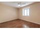 Bright bedroom with wood floors, ceiling fan, and large closet at 10918 Se 50 Ave, Belleview, FL 34420