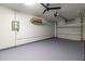 Garage interior with overhead door and painted floor at 10918 Se 50 Ave, Belleview, FL 34420