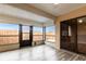 Sunroom with wood-look flooring and sliding glass doors at 10918 Se 50 Ave, Belleview, FL 34420