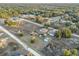 Aerial view showing a house, fenced yard, pool, and expansive land at 13165 Sw 107Th St, Dunnellon, FL 34432