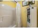 Clean bathroom with shower/tub combo, and built-in storage at 13165 Sw 107Th St, Dunnellon, FL 34432