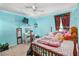 Bedroom with light blue walls, a double bed, and plenty of storage at 13165 Sw 107Th St, Dunnellon, FL 34432