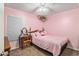 Charming bedroom with pink walls and a comfy bed at 13165 Sw 107Th St, Dunnellon, FL 34432