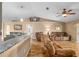 Vaulted ceiling living room with hardwood floors and comfy couches at 13165 Sw 107Th St, Dunnellon, FL 34432