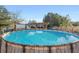 Large above-ground pool with wood-like accents at 13165 Sw 107Th St, Dunnellon, FL 34432