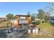 Relaxing pool area with pergola and fire pit at 13165 Sw 107Th St, Dunnellon, FL 34432