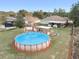 Large above ground pool with deck and pergola at 13165 Sw 107Th St, Dunnellon, FL 34432