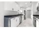 Bright kitchen featuring white cabinets and marble flooring at 14108 Se 42Nd Ter, Summerfield, FL 34491