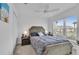 Comfortable bedroom with a queen-size bed and window at 1789 Usrey Ct, Okahumpka, FL 34762