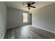 Simple bedroom with vinyl plank flooring and a window at 20653 Sw Audubon Ave, Dunnellon, FL 34431