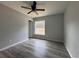 Spacious bedroom with vinyl plank flooring and a window at 20653 Sw Audubon Ave, Dunnellon, FL 34431