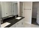 Elegant bathroom features double sinks with granite countertops and tiled floors at 2154 Nw 23Rd Loop, Ocala, FL 34475