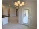 Bright and airy dining room with a chandelier, tile floors, and a glass door to the patio at 2154 Nw 23Rd Loop, Ocala, FL 34475